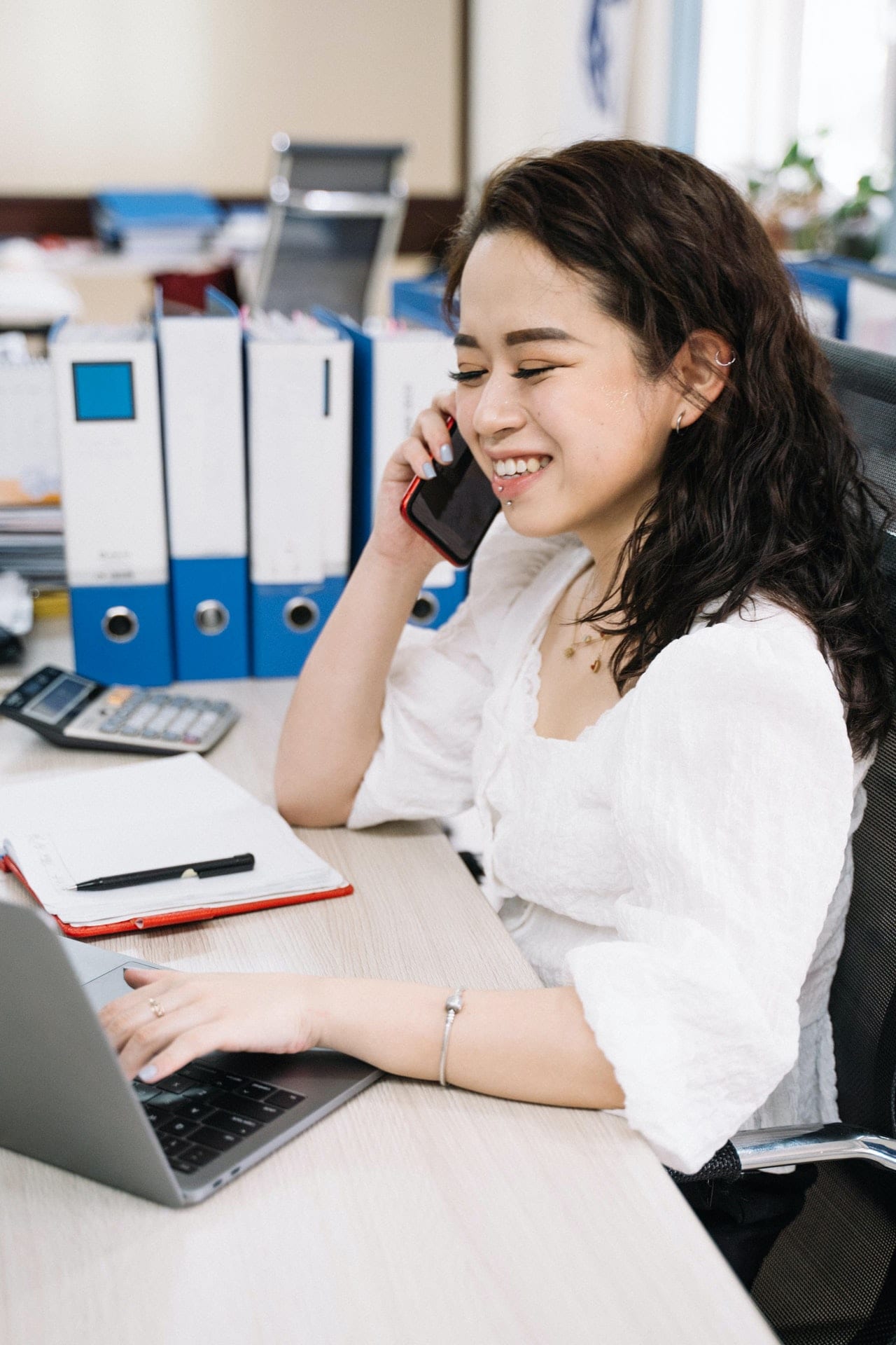 A tax relief services agent taking a phone call in Tulsa, OK